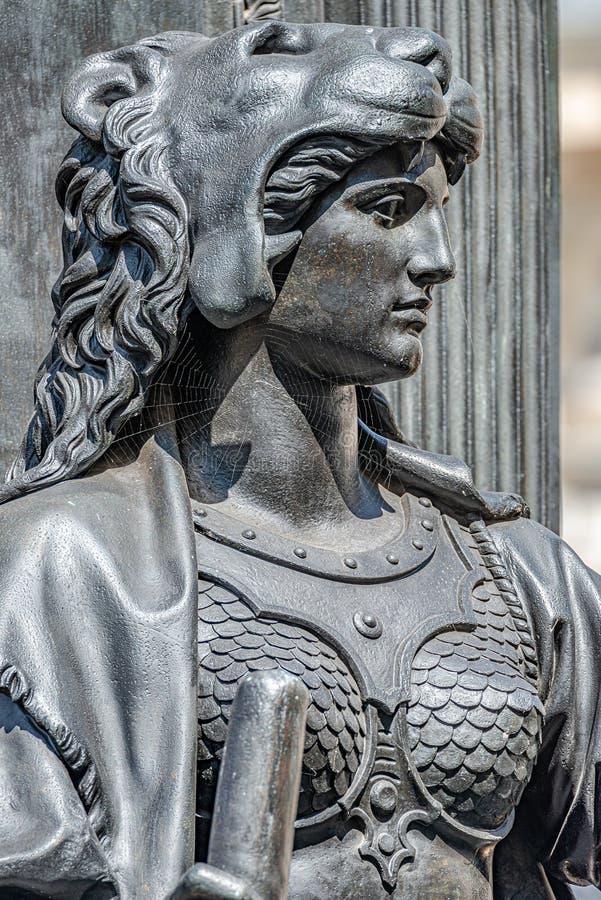 Old statue of a sensual woman warrior, Amazonian, as defender with lion head and club at the Neumarkt in downtown of Dresden