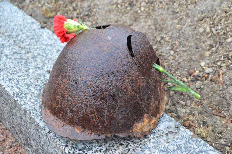 Old steel helmet on war memorial