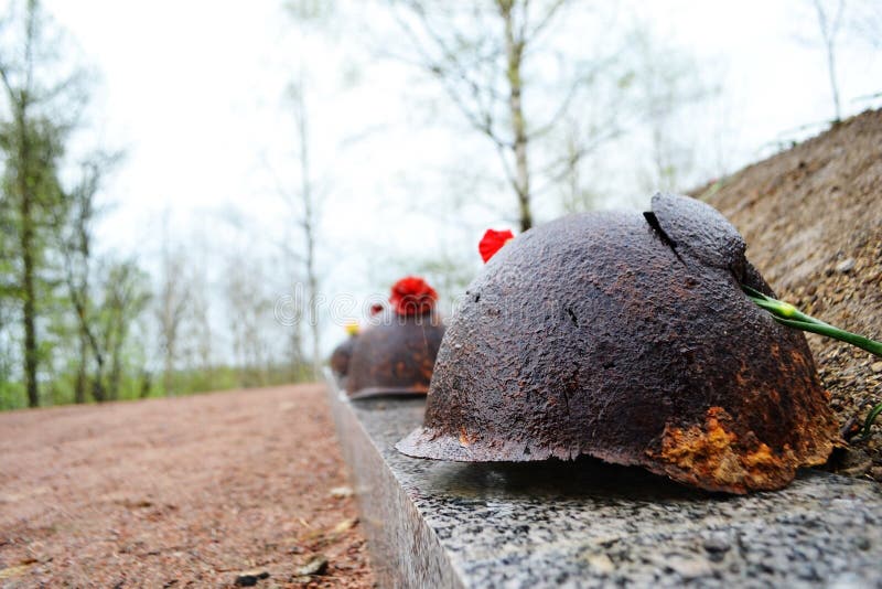 Old steel helmet on war memorial