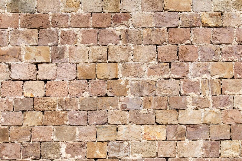 Old stone brick wall surface. Old stone brick wall surface