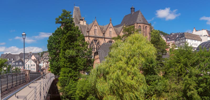 Old stone building of the oldest medieval university in Marburg on a sunny day. Germany. Hesse. Old stone building of the oldest medieval university in Marburg on a sunny day. Germany. Hesse.