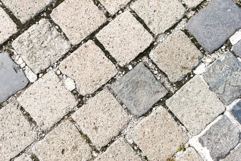 Old Granite Cobblestone Pavement or Road Pattern Texture. Regular Rows