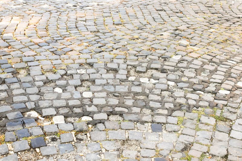 Old Granite Cobblestone Pavement or Road Pattern Texture. Regular Rows