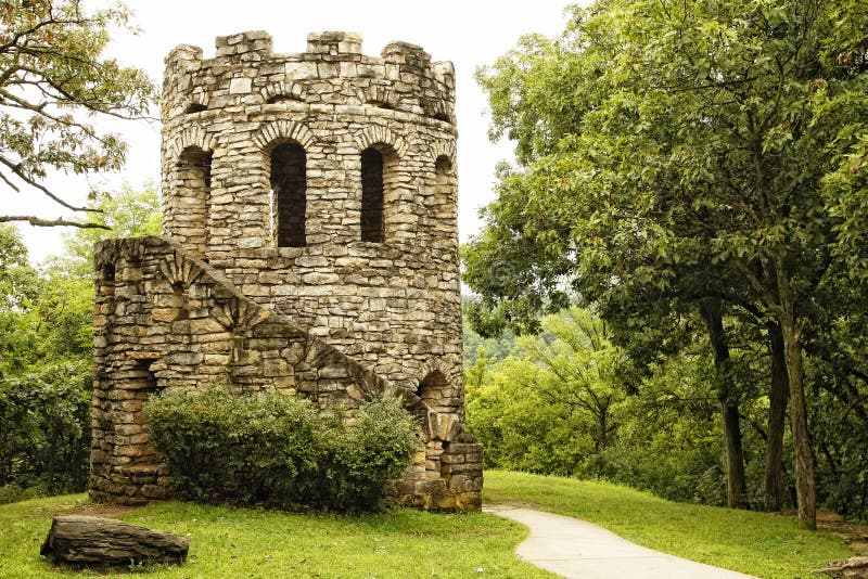 Old Stone Tower in Lush Green Scenery stock photo