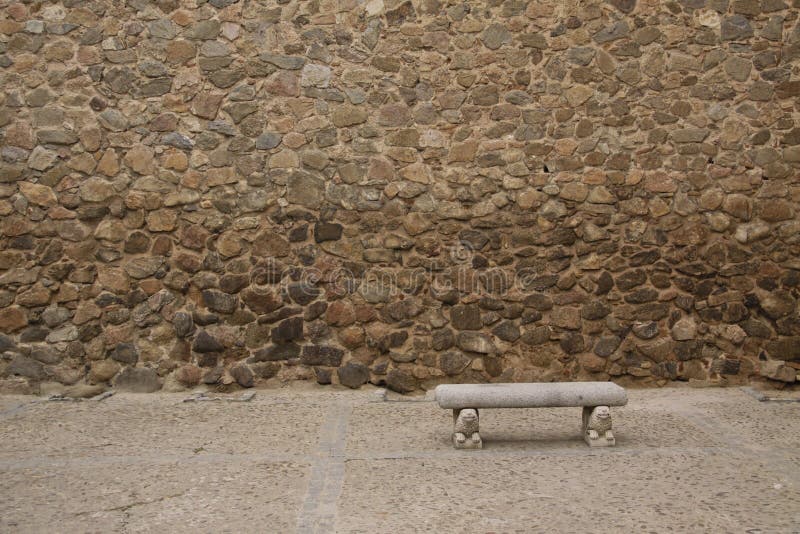 Old stone wall with bench