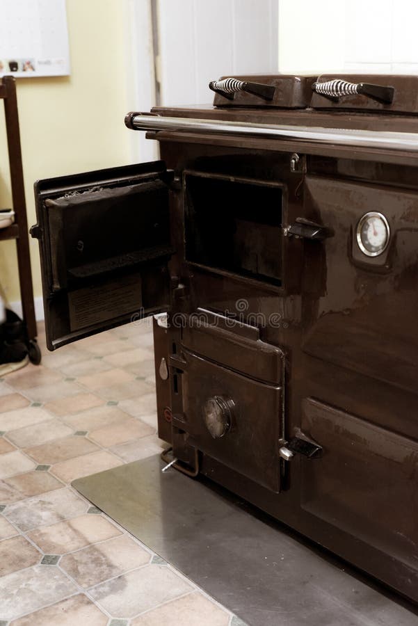 Old Style Oil Burning Stove in Retro Kitchen Interior Stock Photo