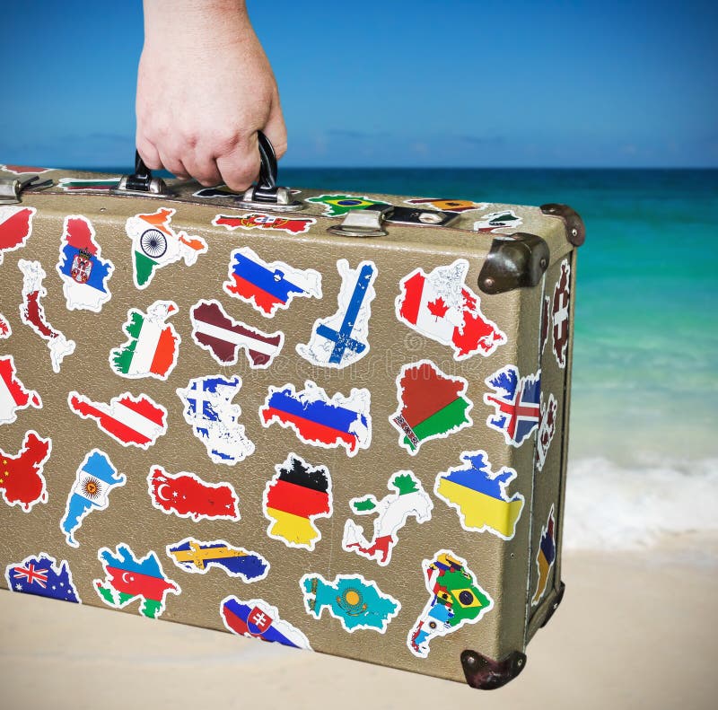 Suitcase With Stickers From Around The World Stands On The Platform ...