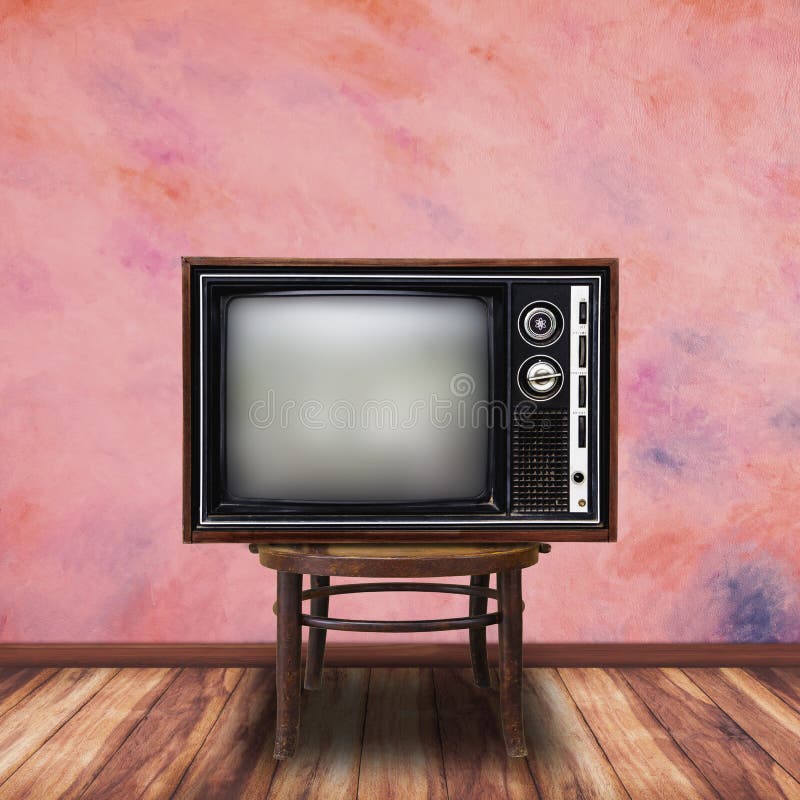 Old television on wood chair in room background.