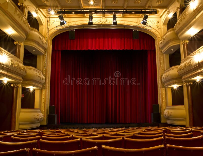Old theater stage and red curtain