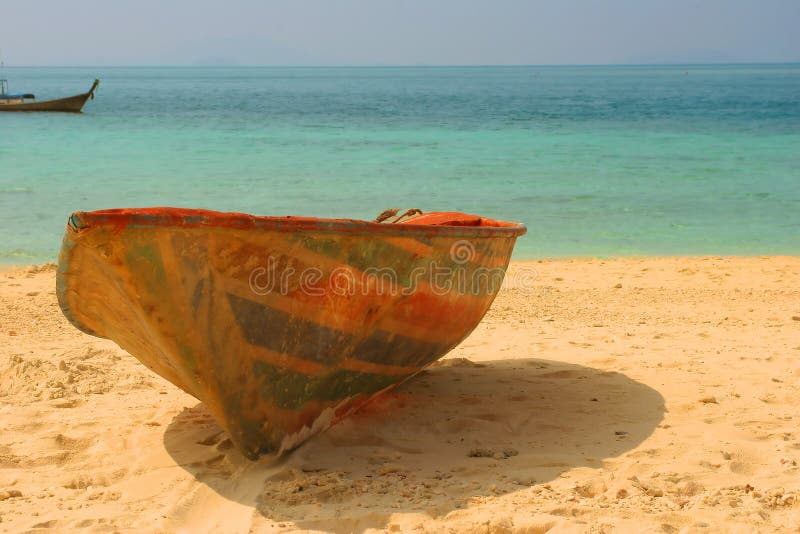 Old thrown boat on a beach