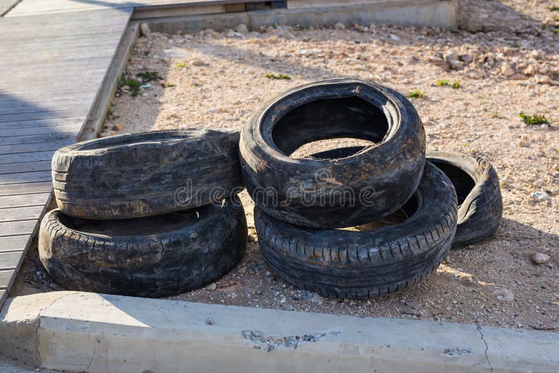 Old tires on the ground stock photo. Image of object 90782602