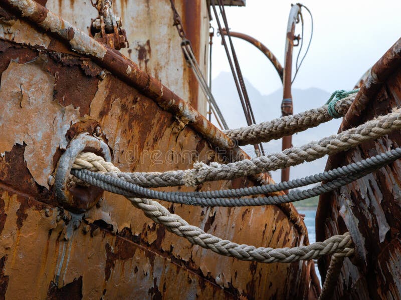 Ropes on Old Rusty Ship Closeup. Old Frayed Boat Rope as a