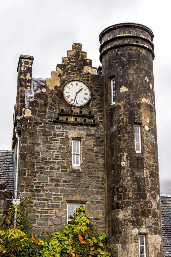 An old tower building with clock at Benmore Botanic Garden, Scotland
