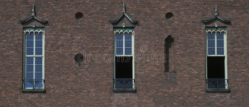Old town building wall with three window