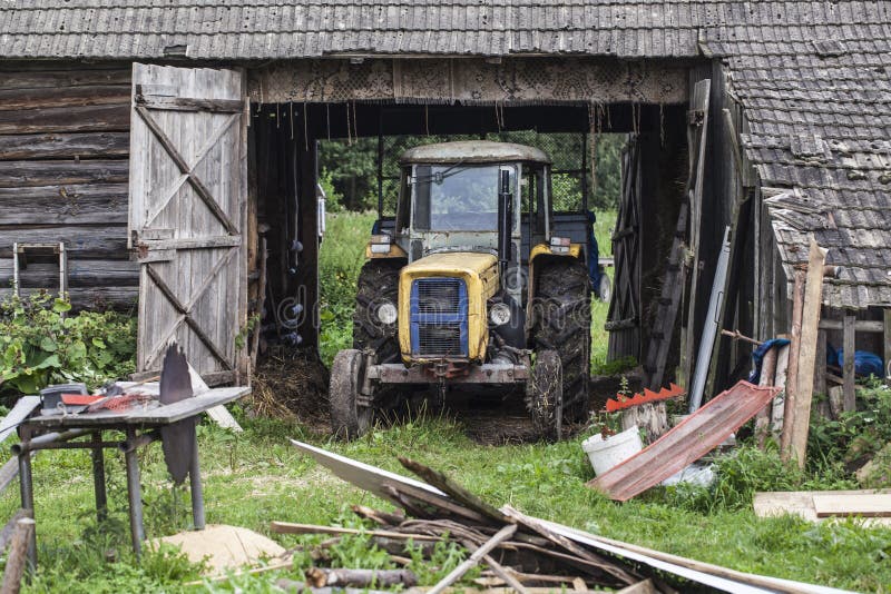 Old Yellow Tractor Inside Garage Stock Image Image of harvest, cloud