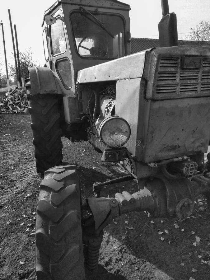 old tractor parked near the road close-up royalty free stock photography old tractor parked near the road close-up royalty free stock photography