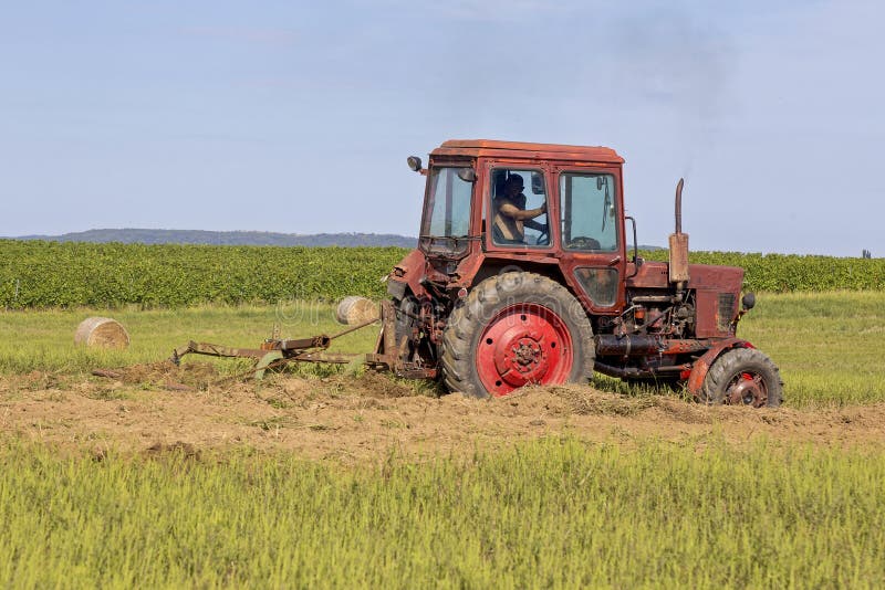 Old Tractor Working on the Field Stock Image Image of plowshare, industrial 100682559