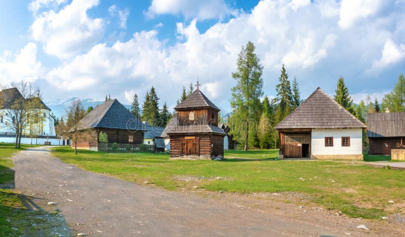 Old traditional houses and wooden belfry of village Pribylina in Liptov region SLOVAKIA - PANORAMA
