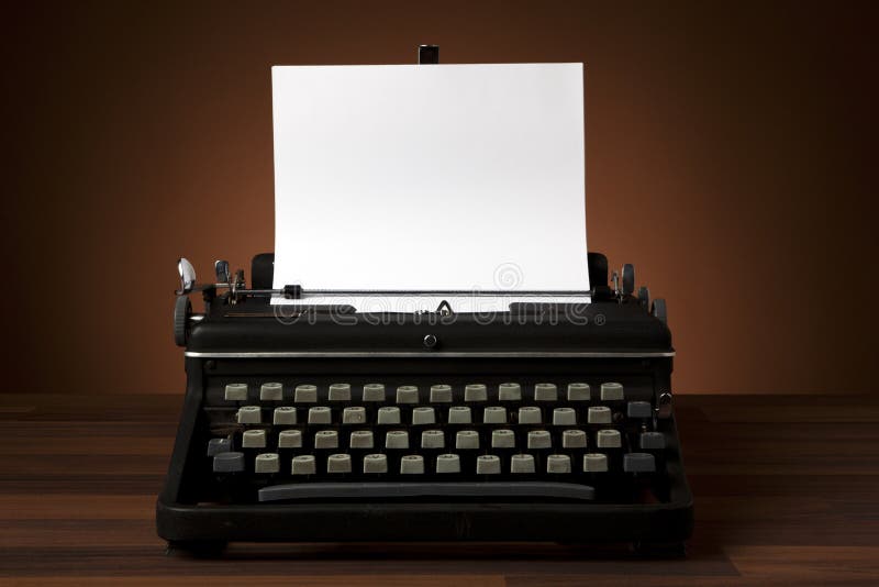 Old Vintage Typewriter With Blank Paper Stock Photo, Picture and Royalty  Free Image. Image 43651663.