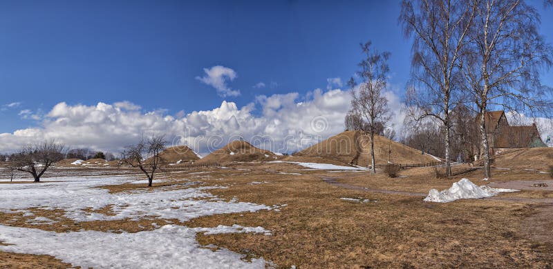 Famous Swedish landmark the iron age burial mounds at Old Uppsala and medieval church. Famous Swedish landmark the iron age burial mounds at Old Uppsala and medieval church