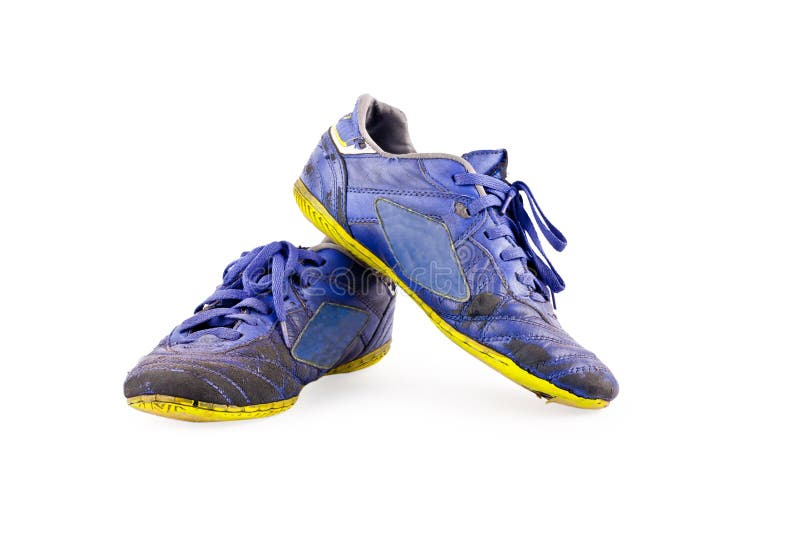 Old used blue worn out futsal sports shoes on white background soccer sportware object isolated royalty free stock image Old used blue worn out futsal sports shoes on white background soccer sportware object isolated royalty free stock image