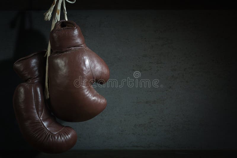 Old Used Boxing Gloves, Hanging before a Dirty Wall Stock Photo Image