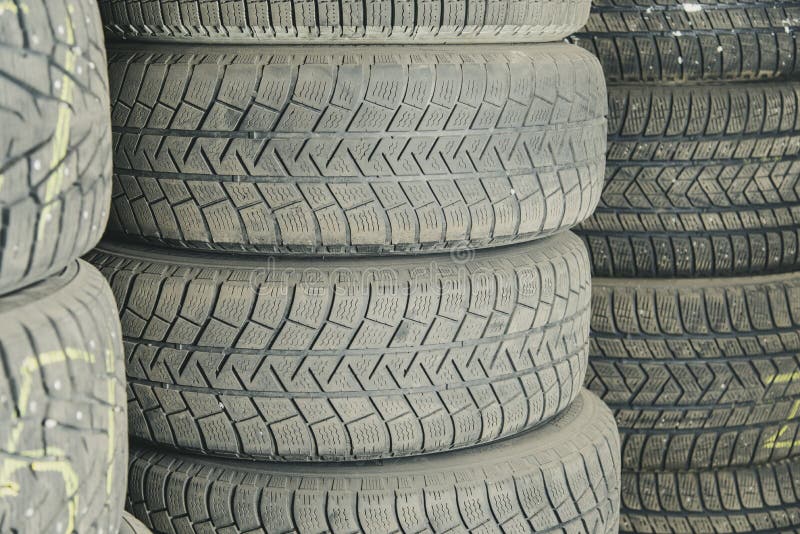 Old and used car tires. Background. Car tires in storage. Car tire recycling stock image Old and used car tires. Background. Car tires in storage. Car tire recycling stock image