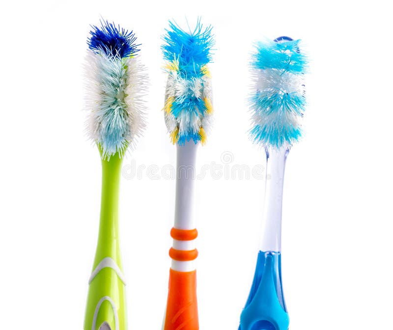 Old used colorful toothbrushes