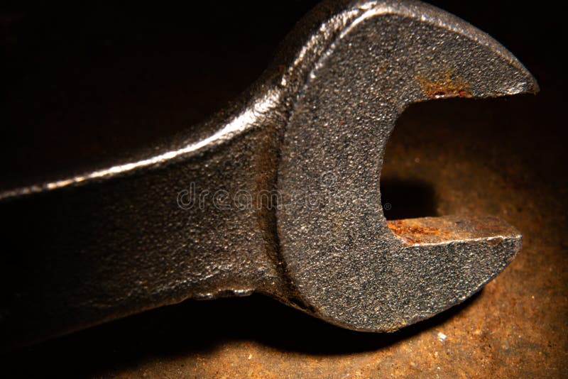 Old used metal wrench in grunge lighting royalty free stock photos Old used metal wrench in grunge lighting royalty free stock photos