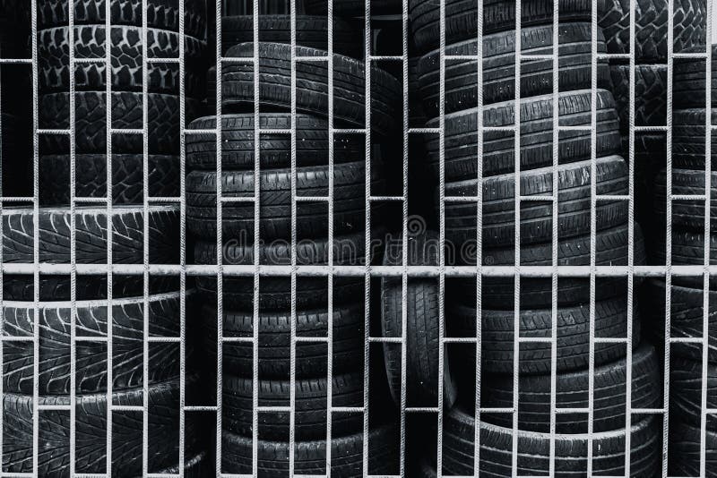 Old used tire keeping in the cage stock photos