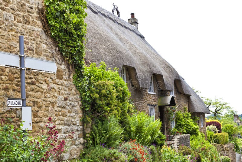 Old village house with cottage flowering garden stock photos Old village house with cottage flowering garden stock photos