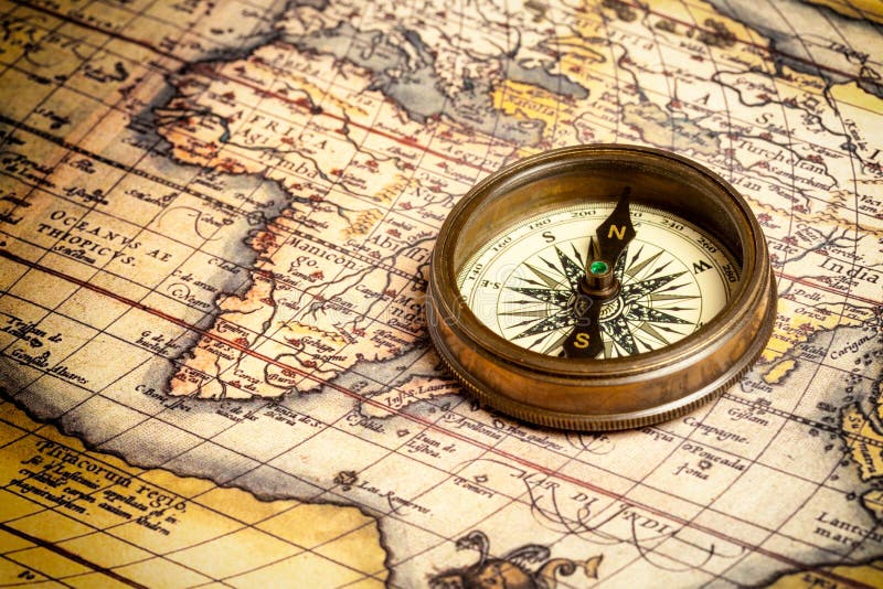 Compass and Chess on old map Stock Photo by ©kwanchaidp 75914583