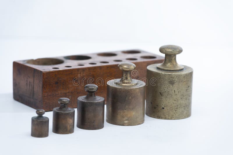 Old and Vintage Iron Scale Weights on the White Background Stock Photo