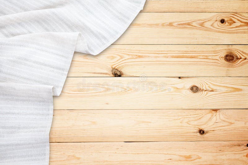 Old vintage wooden table with white tablecloth. Top view mockup.