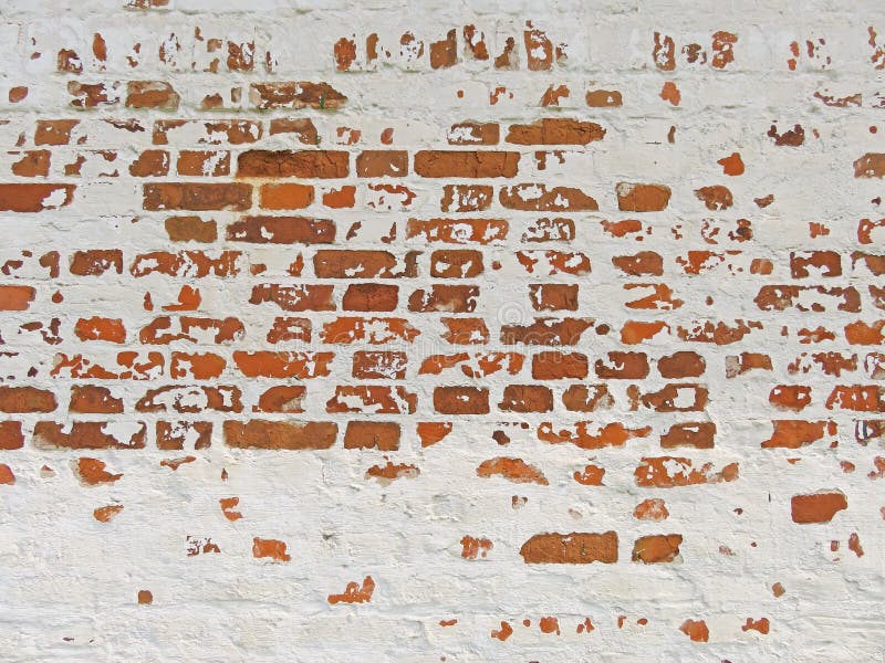 Red, Terracotta and White Brick Background. Old Wall of Red Bricks and White Brayed and Cracked Old Paint.