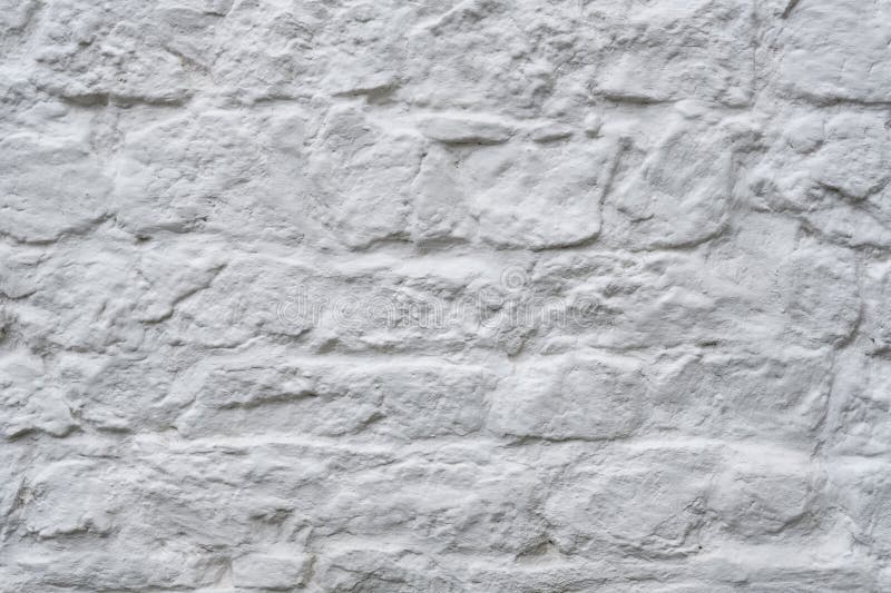 Old wall from a white brick background. Concrete fragment stock images, royalty-free photos and pictures