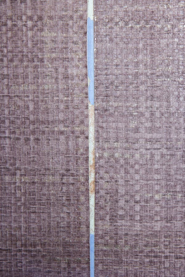 Old Wallpaper Dried and Peeling Off the Wall Exposing Previous Paint