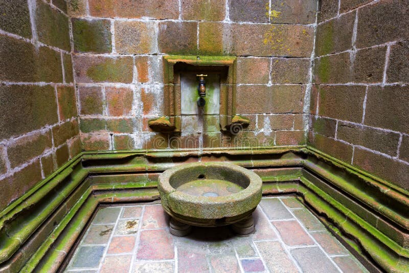 Old washbasin in Mont Saint-Michel abbey, France