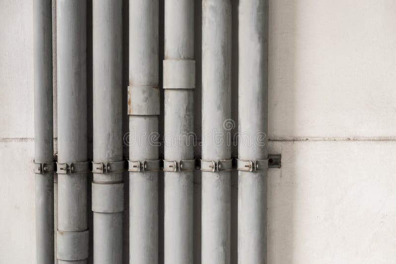 Old water pipes on wall stock photo Old water pipes on wall stock photo