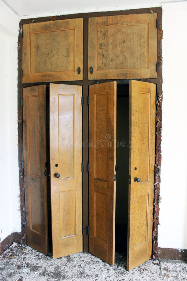 Old Weathered Wooden Cabinet With Peeling Paint At Abandoned