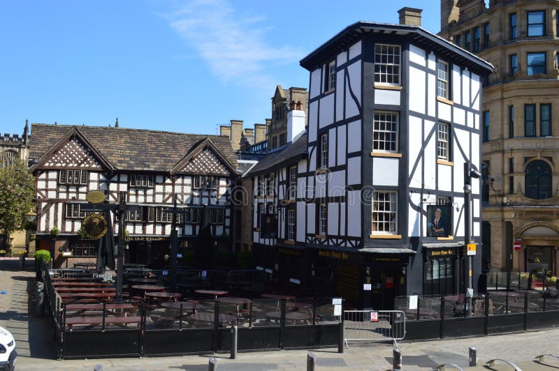 The Old Wellington Inn is a half-timbered pub in Manchester city centre, England. It is part of Shambles Square, which was created in 1999, and is near Manchester Cathedral. It is a Grade II listed building. The Old Wellington Inn is a half-timbered pub in Manchester city centre, England. It is part of Shambles Square, which was created in 1999, and is near Manchester Cathedral. It is a Grade II listed building