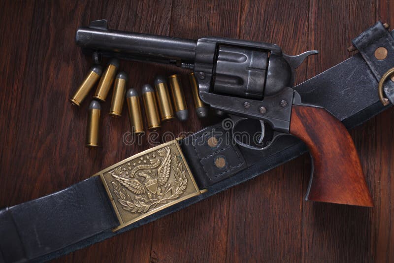 Old western revolver with cartridges