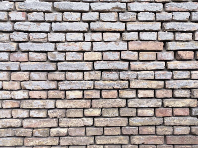 Old Wet Brick Wall with Devastating Bricks. Brick Surface As Background, Empty Brick Wall
