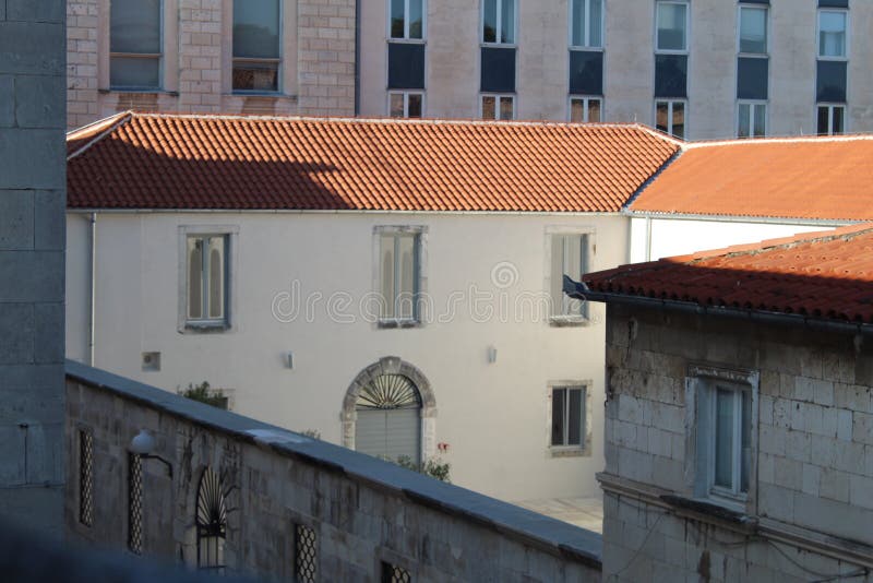 Old white building with red clay roof tiles in Slovakia