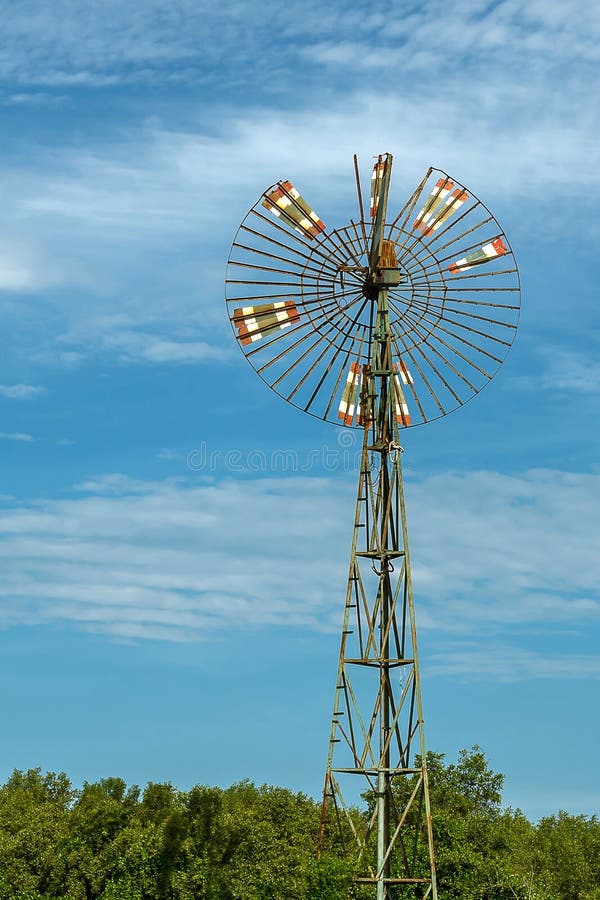 Old wind turbine powered water pump. Texas wind energy turbines stock images, royalty-free photos and pictures
