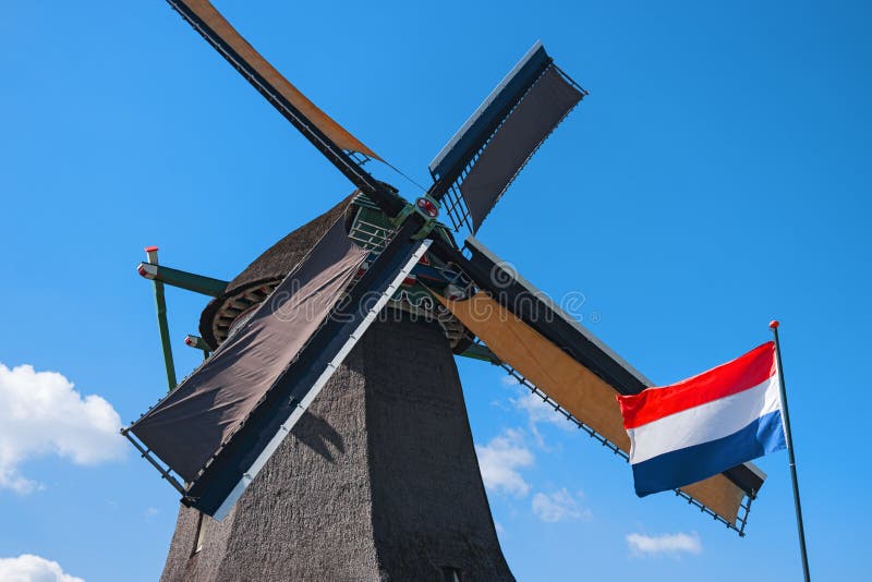 Old windmill and flag, Zaanse Schans, Netherlands