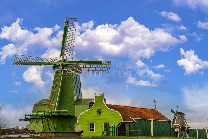 Old windmill in traditional colors at the Zaanse Schans near Koog aan de Zaan, Holland