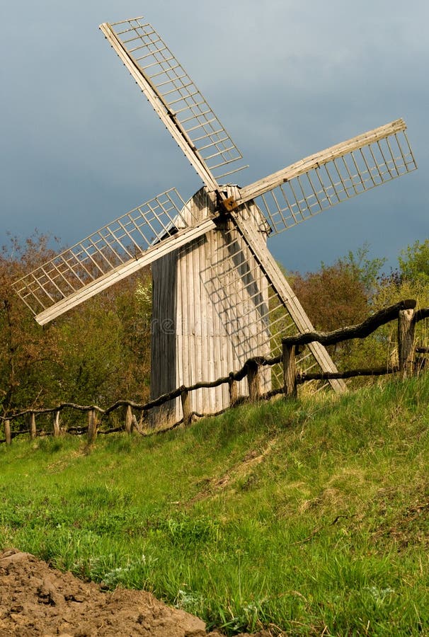 Old windmill and wooden fence