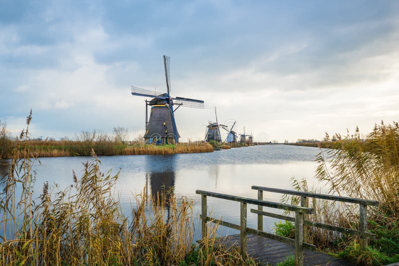 Old windmills in Kinderdijk at sunrise, Holland, Netherlands, Eu