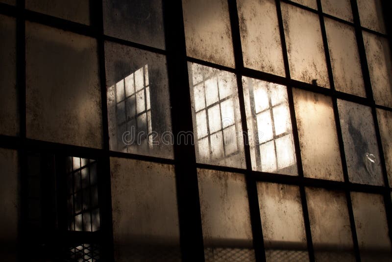 Old windows in abandoned warehouse